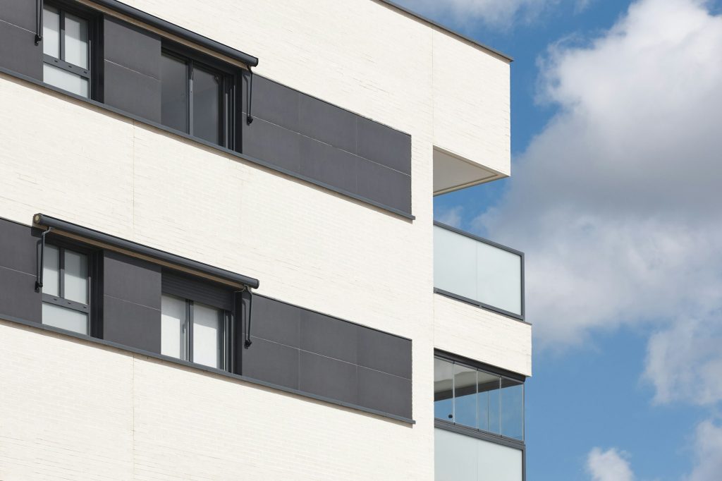 New building exterior facade with terrace. Construction. Buy, rent
